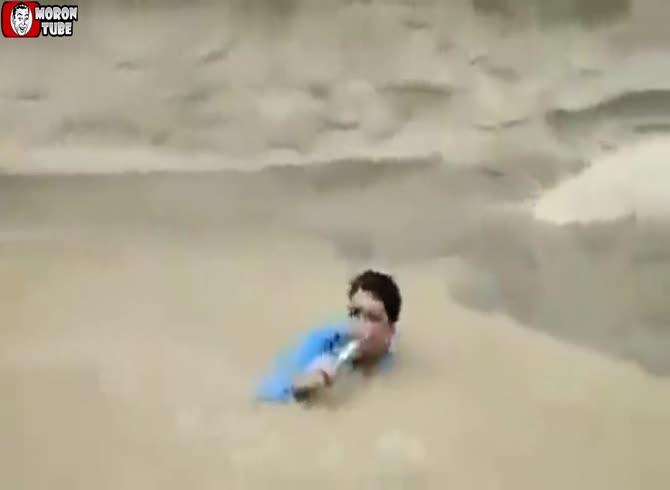 Video :This reporter could be going overboard during floods!